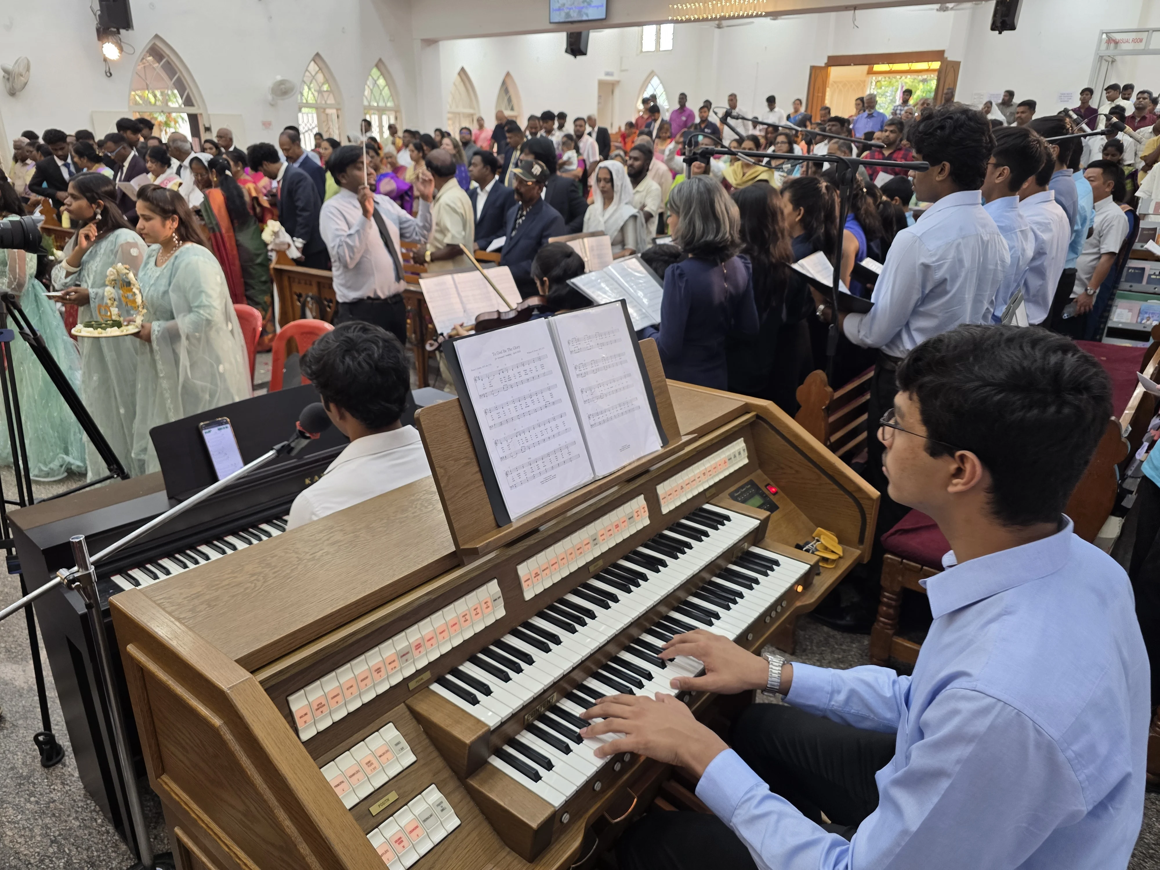Aaron playing the organ at Indiranagar Methodist Church, Bangalore