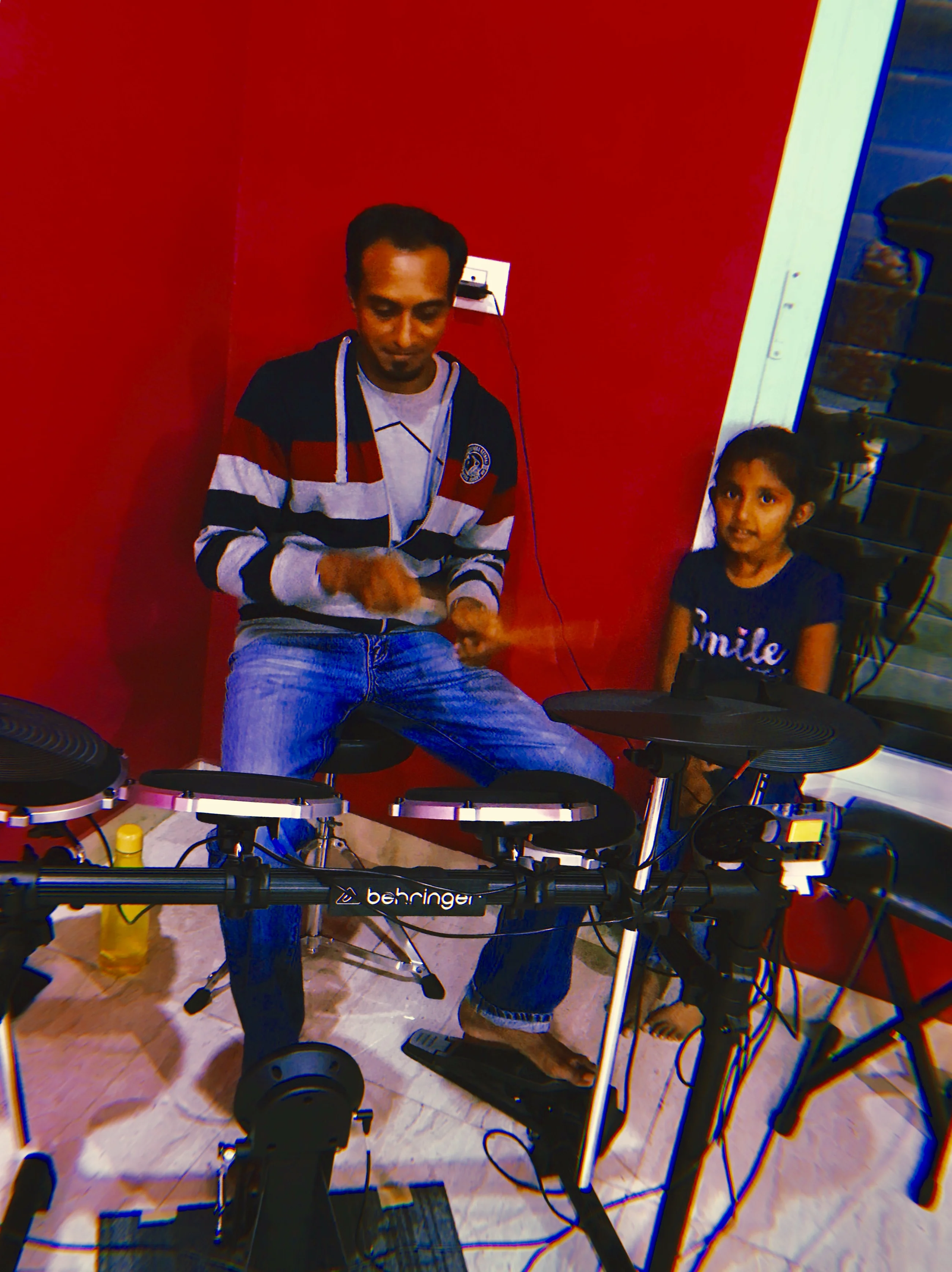 Early drum class at Fingersmith's Garage — teacher demonstrating on Behringer electronic kit