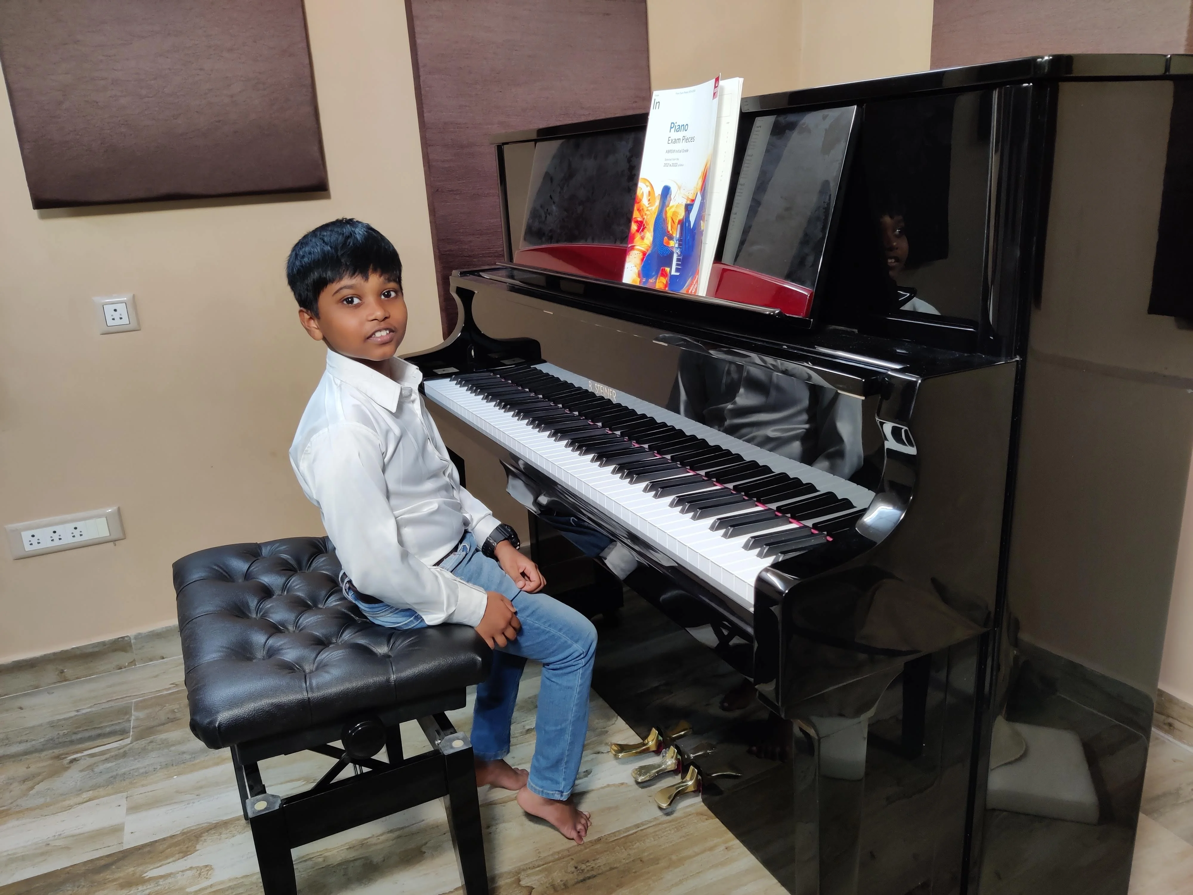 Young piano student at ABRSM grade exam at Fingersmith's Garage