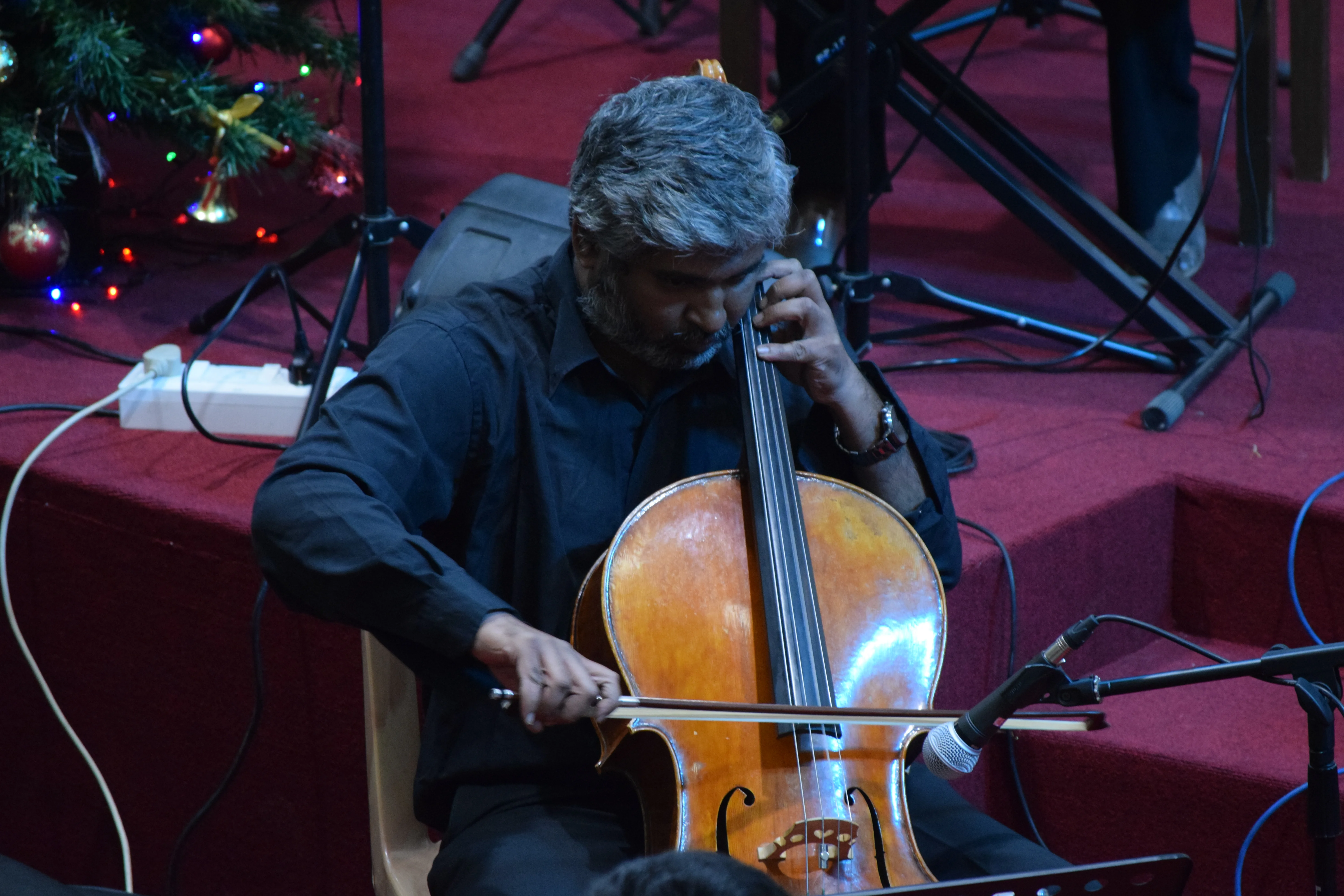 Guest cellist Anup Thomas performing with The Fingersmith Collective at BBC Christmas 2021
