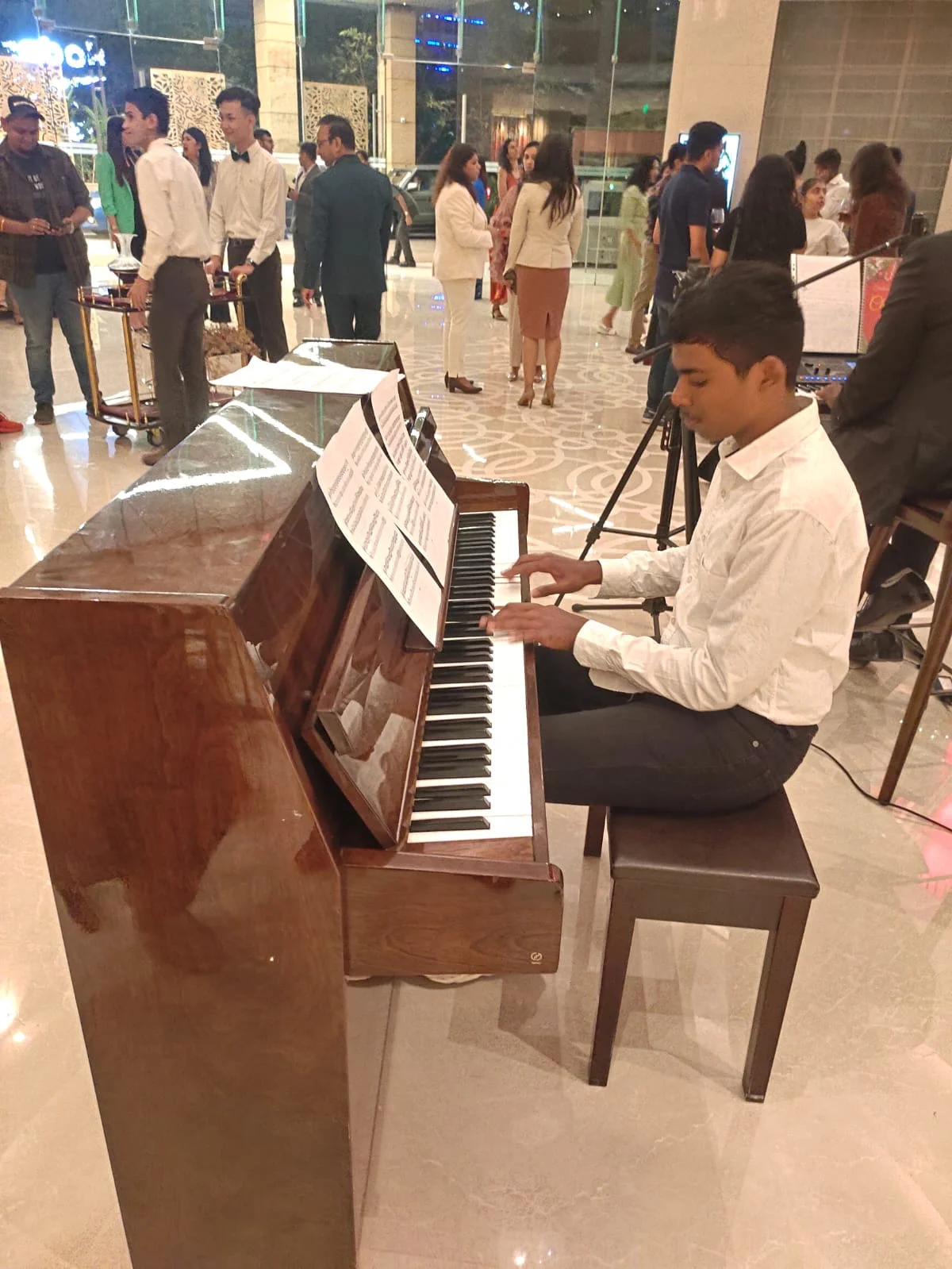 FSG student Kishan performing piano at Conrad Hotel Bangalore — Christmas performance 2023