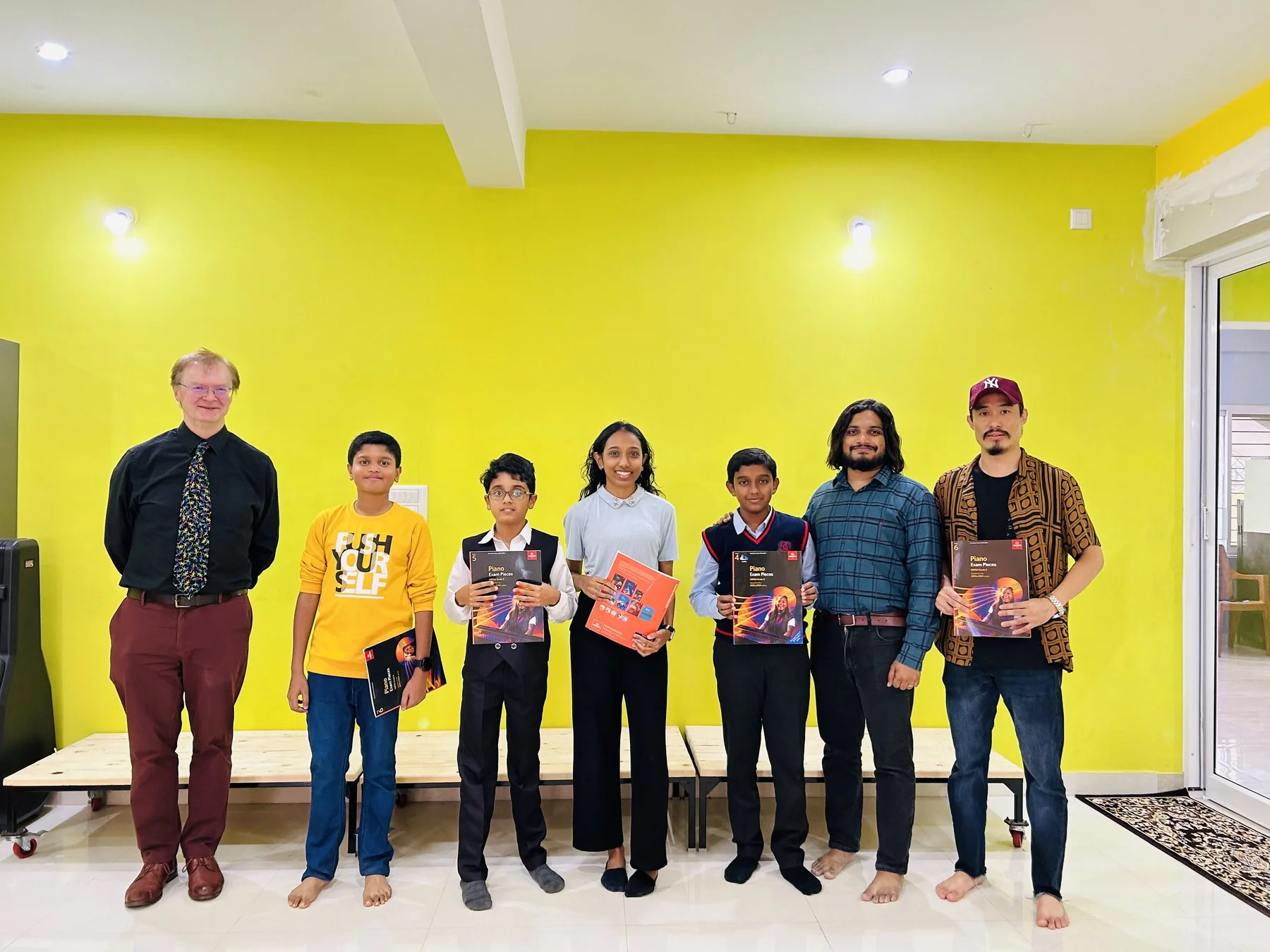 Students with ABRSM examiner Richard Lewis at Fingersmith's Garage December 2023